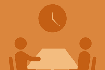 An icon that depicts two people holding a meeting at a table underneath a clock